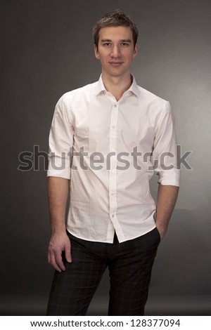 Portrait of a young handsome man a white shirt