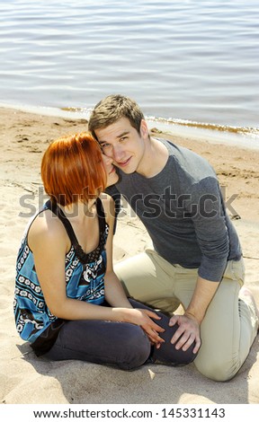 Portrait of a young beautiful happy couple outside