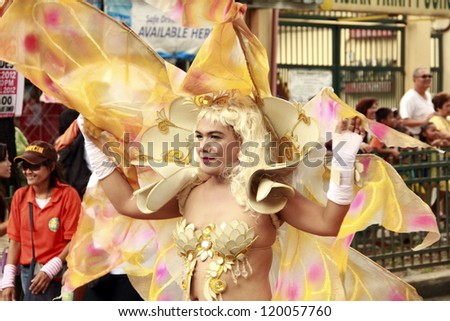 CAVITE, PHILIPPINES - NOV. 26: Government employee participate in the 2nd Paru-paro Festival on Nov. 26, 2012 in Dasmarinas City Cavite, Philippines.  Groups compete with dance & costume competition.