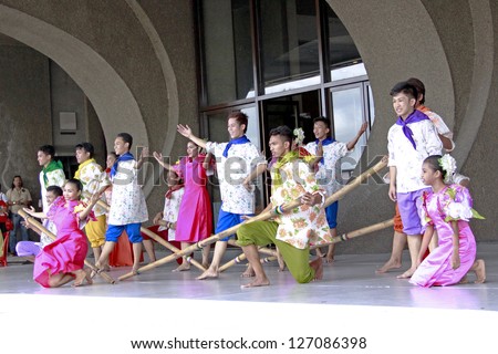 MANILA, PHILIPPINES -FEB 3:Tinikling Dancers perform cultural dance in Pasinaya 2013 on February 3, 2013 in CCP Manila. The Pasinaya Open House Festival is the largest multi-arts in the Philippines