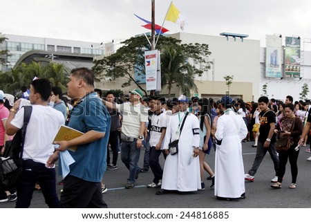 MANILA - JAN 16 2015: Pope Francis as he  arrives in MOA Arena in the Papal visit in Manila on January 16, 2015 The papal motorcades are tightly controlled with the pope waving from a passing vehicle.