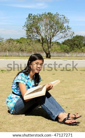 Young lady studying in the park