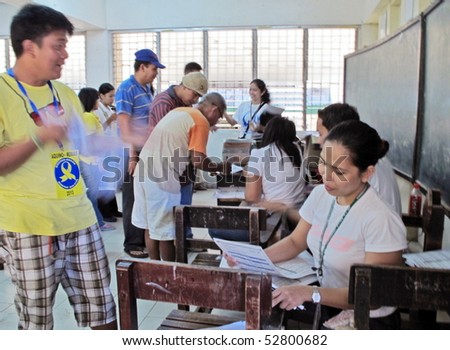 CAVITE, PHILIPPINES - MAY 10: Voters exercise their rights for the Presidential Election on May 10, 2010 in the Philippines. First time that the Commission on Election will implement full automation.
