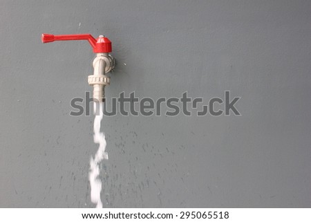 Waste water from red faucet