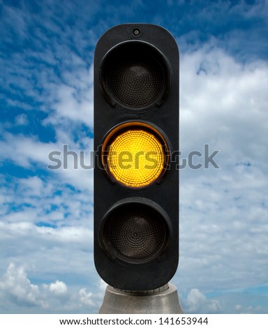 Yellow traffic lights against blue sky backgrounds. Clipping Path included.