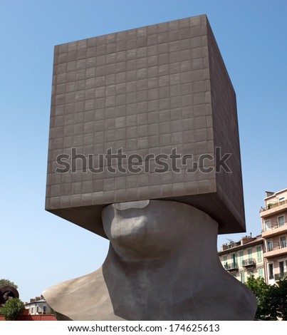 NICE, FRANCE - MAY 2: Square Head - building cube shaped as human head sculpture on May 2, 2013 in Nice, France. Authors are sculptor Sacha Sosno and architect Yves Bayard. Opened on June 29, 2002.