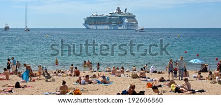 CANNES, FRANCE - MAY 6: People on the most popular beach - Plage de la Croisette on May 6, 2013 in Cannes, France. The famous beach on the Croisette, known for its filmfestival in may.