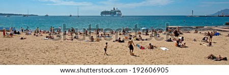 CANNES, FRANCE - MAY 6: People on the most popular beach - Plage de la Croisette on May 6, 2013 in Cannes, France. The famous beach on the Croisette, known for its filmfestival in may.