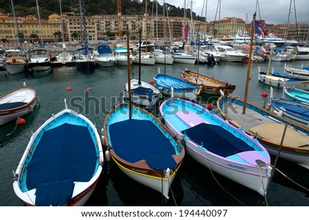 NICE, FRANCE - APRIL 27: Colorful buildings and boats within a Port de Nice on April 27, 2013 in Nice, France. Port de Nice was started in 1745.