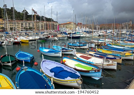 NICE, FRANCE - APRIL 27: Colorful buildings and boats within a Port de Nice on April 27, 2013 in Nice, France. Port de Nice was started in 1745.