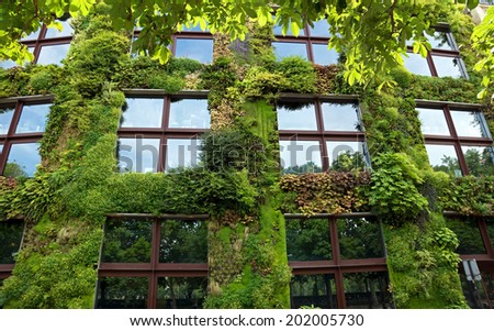 PARIS, FRANCE - JUNE 9: Quai Branly Museum on June 9, 2014 in Paris, France. The green wall on part of the exterior of the museum was designed and planted by Gilles Clement and Patrick Blanc.