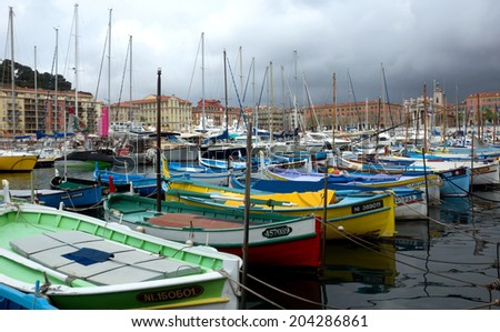 NICE, FRANCE - APRIL 27: Colorful boats in the Port de Nice on April 27, 2013 in Nice, France. Port de Nice was started in 1745.