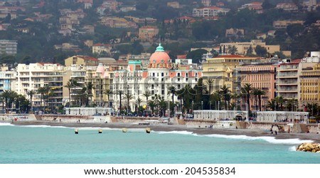 NICE, FRANCE - APRIL 27, 2013: Luxury resort on French Riviera with view of Hotel Negresco on April 27, 2013 in Nice, France. It is the famous luxury hotel on the Promenade des Anglais.