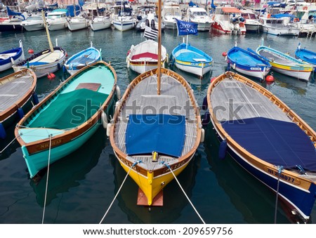NICE, FRANCE - APRIL 27: Colorful boats in the Port de Nice on April 27, 2013 in Nice, France. Port de Nice was started in 1745.