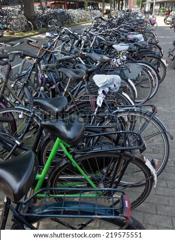 AMSTERDAM, NETHERLANDS - MAY 30: Amsterdam Central station. Many bicycles parked near of the Central station on May 30, 2014 in Amsterdam, Netherlands.