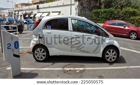 NICE, FRANCE - JUNE 6, 2014: Smart electric drive cars charging at on-street stations.