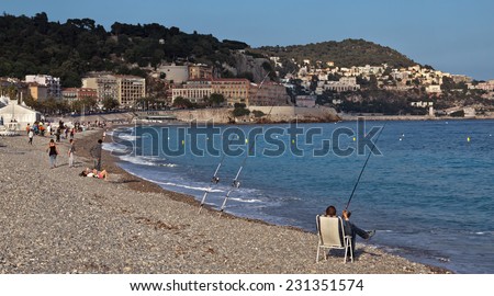 NICE, FRANCE - MAY 31, 2014: Beach Angel bay in Nice, France. Citizens and tourists sunbathing enjoying a sunny day on the beach.