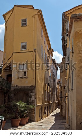 GRASSE, FRANCE - JUNE 2, 2014: Old street in the southern France in Grasse, France. Grasse is famous for its perfume industry. The city was founded in the XI century.
