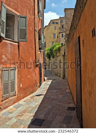 GRASSE, FRANCE - JUNE 2, 2014: Old street in the southern France in Grasse, France. Grasse is famous for its perfume industry. The city was founded in the XI century.