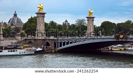 PARIS, FRANCE - JUNE 9, 2014: Pont Alexandre III, Paris, France. The bridge, with its Art Nouveau lamps, cherubs, nymphs and winged horses at either end, was built between 1896 and 1900.