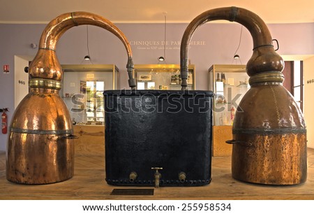 GRASSE, FRANCE - JUNE 2, 2014: Ancient distiller for the production of perfume in Fragonard factory. Fragonard perfumery is one of the older factory in the world capital of perfumes.
