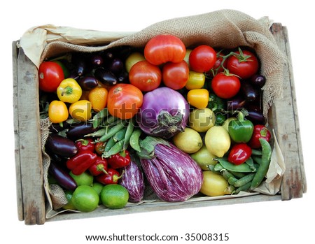 stock photo : Just harvested fresh and ripe biological vegetables and fruits in a wooden box isolated over white. Clipping path.