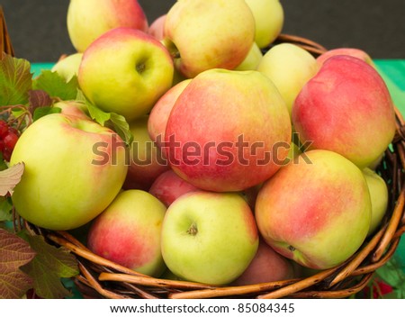 Fresh apples in wicker basket on the street market