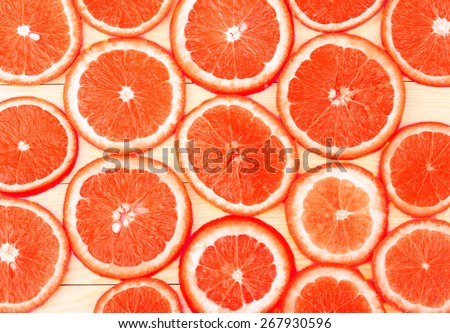 ripe grapefruit on white boards, food closeup (seen from above)