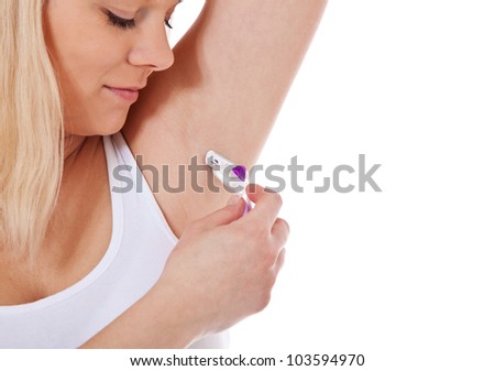 Attractive young woman shaving her armpits. All on white background.