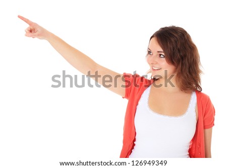 Attractive teenage girl points with finger. All on white background.