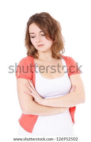 Attractive teenage girl in bad mood. All on white background.