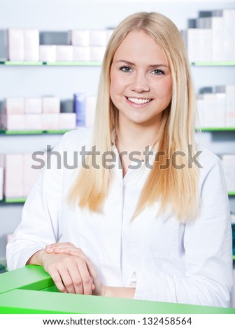 Attractive saleswoman in pharmacy.