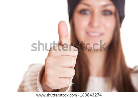 Attractive young woman showing thumbs up. All on white background.