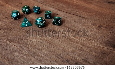 Various dices on wooden table