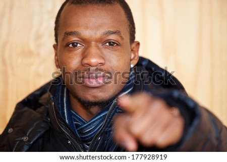 Black guy points with finger
