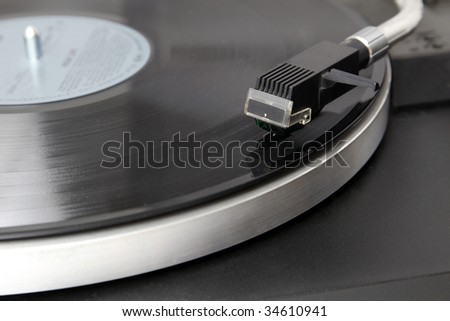 A record player is playing an album