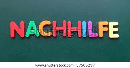 The german term for tutoring in colorful letters on blackboard