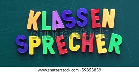 The german term for class representative in colored letters on a blackboard.