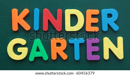 The term Kindergarten in colorful letters on a blackboard.