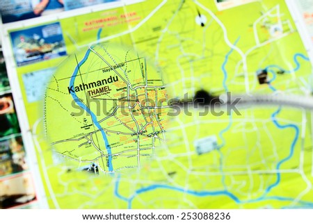 Kathmandu city map through magnifying glass - focus on Thamel - centre of the tourist industry in Kathmandu