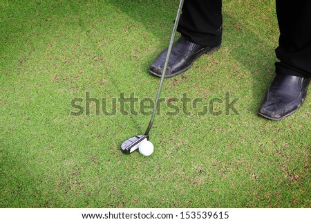 Golf equipment, golf ball with tee on course