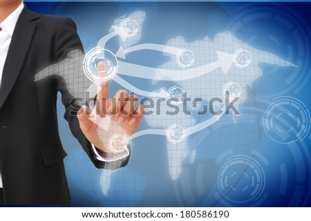 hand of business woman pushing visual screen with world map.