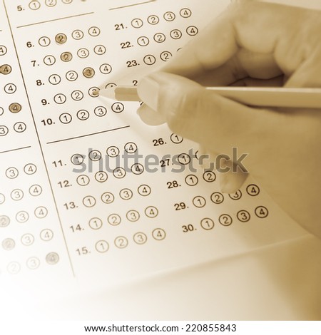 Standardized test form with answers bubbled in and a pencil