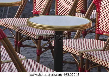 A closeup shot of the table and chairs at Place Plumereau in Tours, France. This area is a part of the old quarters of the city.