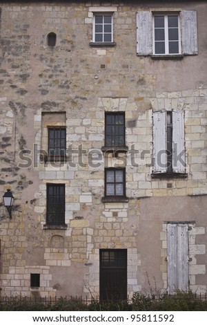Windows at the back of a house in the old quarters of Tours in France. Note the different levels of each one suggesting an uneven floor layout.