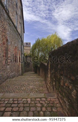 Looking down a cobblestoned back street in the old part of Le Mans in France.