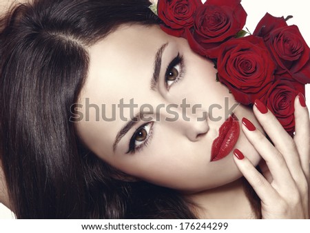 Beauty Portrait With Red Roses, Lipstick And Nail Polish