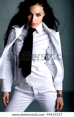 young black hair woman in white suit with tie, studio