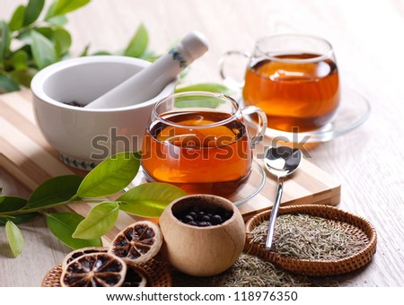 herb tea with ingredient on the table
