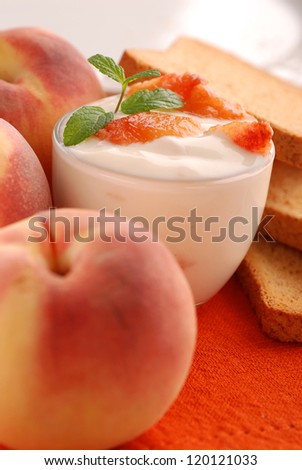 yogurt with peach flavor, decorated with mint leaves